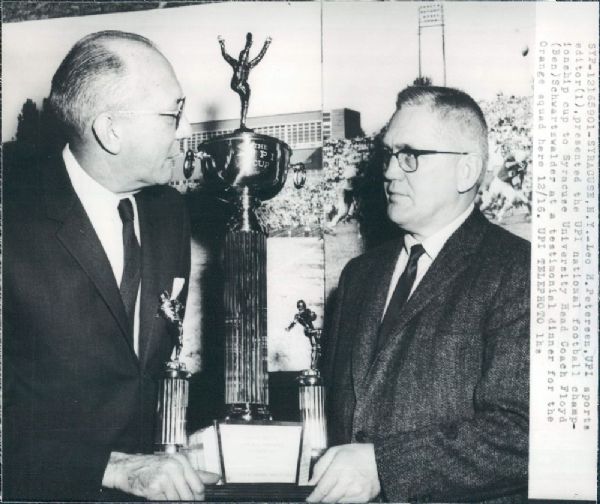 1959 Syracuse Coach Floyd Schwartzwalder with National Championship Trophy UPI photo