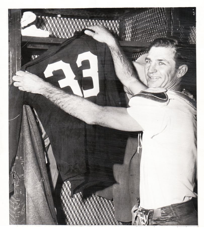 Lot Detail - Sammy Baugh hanging up his jersey for the final time 1952  Redskins original photo